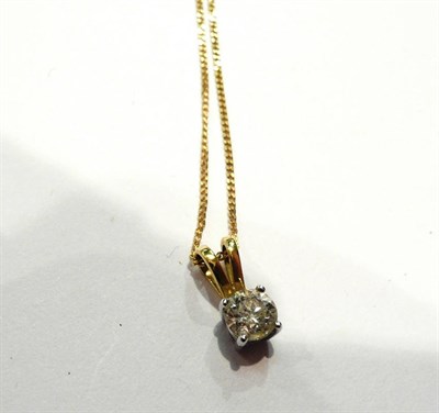 Lot 38 - A diamond solitaire pendant on a fine link chain   Subject to VAT