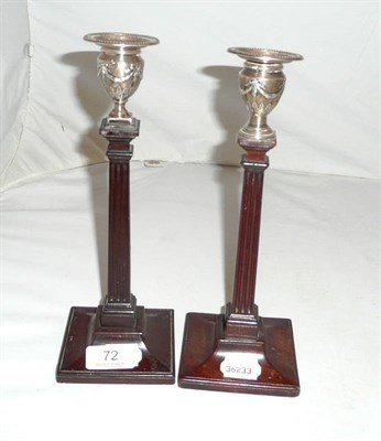 Lot 72 - Mahogany candlestick with silver top and another similar (a.f.)
