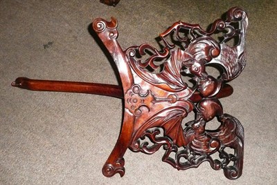 Lot 92 - A Chinese carved huali wood dish stand, late 19th century.