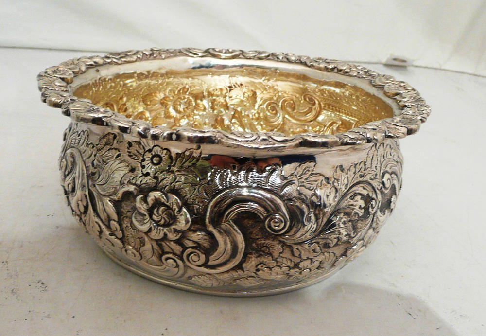 Lot 93 - A Georgian Irish silver bowl with later repousse decoration, hallmarks for Charles Marsh,...