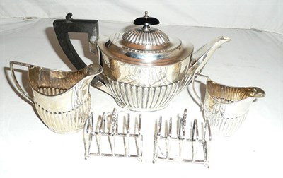 Lot 95 - A silver teapot, two silver jugs and a pair of small toast racks, approx 22.5oz