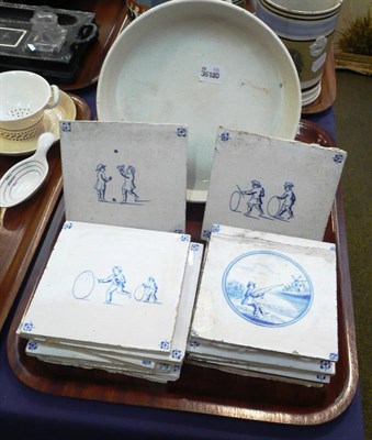 Lot 129 - A pottery char dish and fourteen assorted blue and white tiles (15)