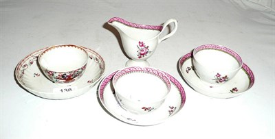 Lot 138 - A Newhall helmet shaped cream jug, two tea bowls and saucers and another tea bowl and saucer
