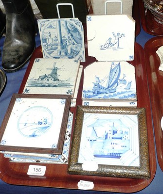 Lot 156 - An English delft tile in an oak frame and twenty-five other tiles (largely damaged) (two trays)