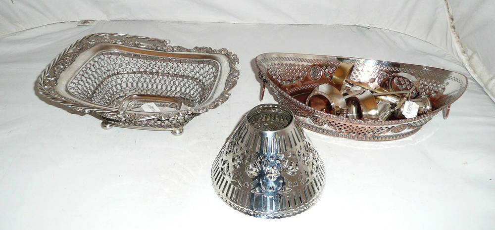 Lot 159 - Two Sheffield plate cake baskets and four plated pierced candle shades and sconces