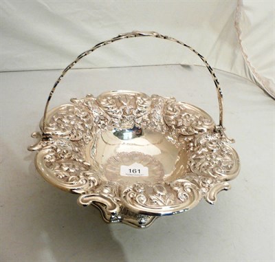 Lot 161 - Embossed silver basket with swing handle, approx 21oz