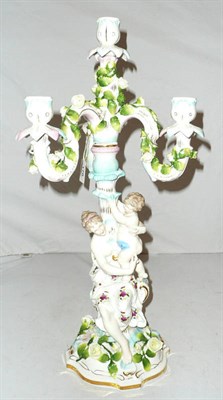 Lot 178 - A Continental porcelain three branch candelabrum