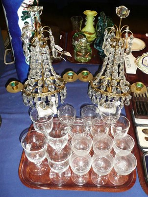 Lot 186 - A pair of brass two branch candelabra with glass drops and a quantity of drinking glasses