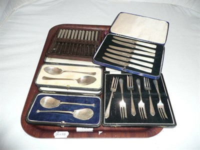 Lot 188 - Cased cutlery including two sets of silver preserve spoons, twelve butter knives with silver...