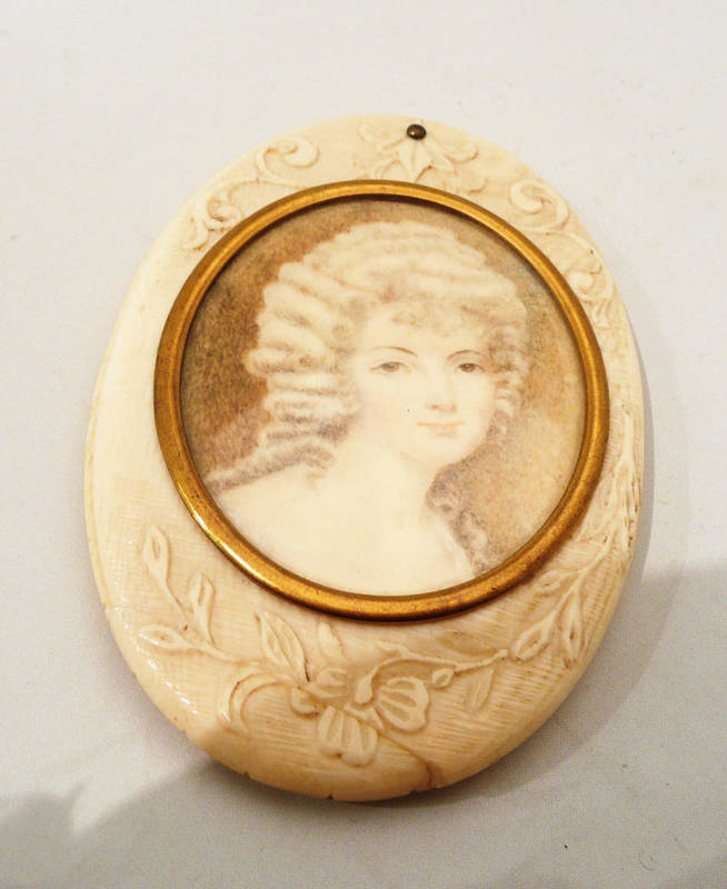 Lot 359 - Small oval vanity mirror set with a miniature portrait