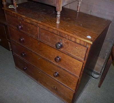 Lot 565 - A 19th century oak chest of two short and three long drawers