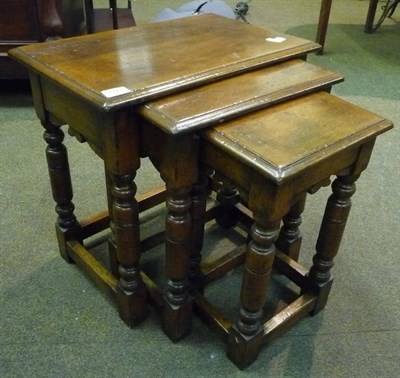 Lot 590 - Nest of three oak reproduction tables