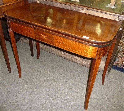 Lot 591 - Late George III mahogany fold over tea table