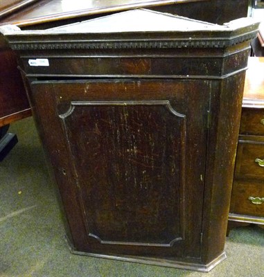 Lot 596 - Georgian oak panelled corner cupboard