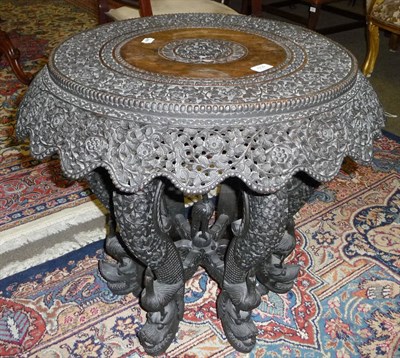 Lot 604 - An Anglo-Indian Bombay carved hardwood side table, circa 1900, the circular top and foliate...