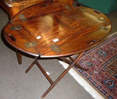 Lot 608 - A George III mahogany butler's tray, early 19th century, with four brass hinged sides, and oval...