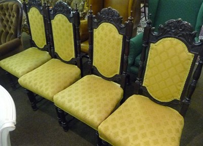 Lot 625 - Set of four carved oak chairs