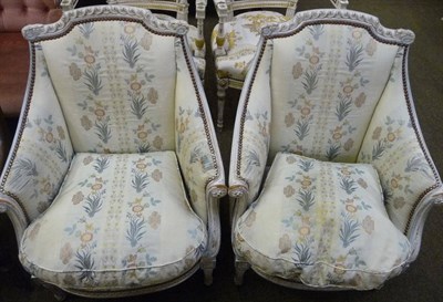 Lot 639 - Pair of French style cream and parcel gilt tub chairs