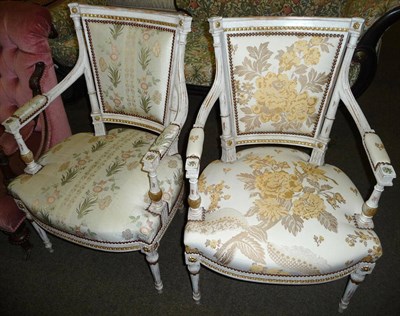 Lot 640 - Two French style cream and gilt painted open armchairs