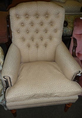 Lot 643 - A modern upholstered button back chair