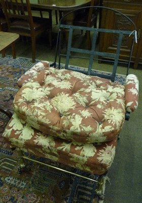 Lot 649 - An early 19th century black wrought iron and brass campaign bed/chair, circa 1835, of three lattice