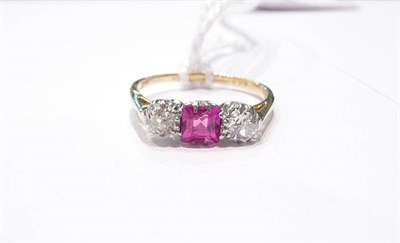 Lot 4 - A ruby and diamond three stone ring