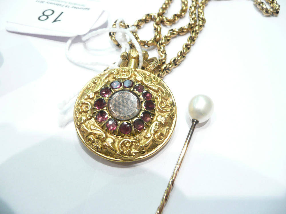 Lot 18 - Gold and amethyst pendant locket on chain and a pearl stick pin