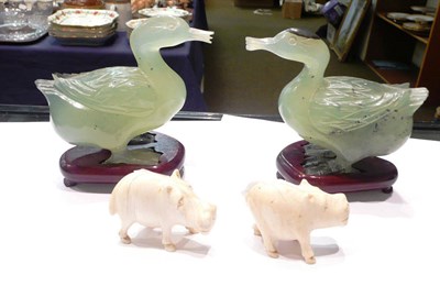 Lot 25 - Two carved jade duck figures, pair of carved ivory pitbull figures