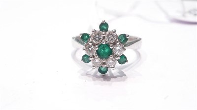 Lot 36 - A diamond and emerald cluster ring