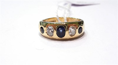 Lot 43 - An 18ct gold diamond and sapphire five stone ring