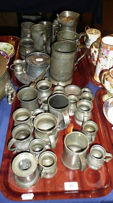 Lot 46 - Two trays of pewter measure, mugs, a tankard etc, also a lidded tureen