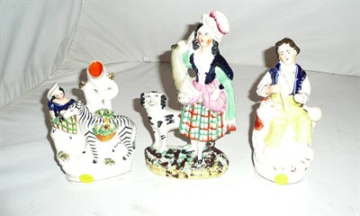 Lot 56 - A Staffordshire zebra spill vase and two other Staffordshire groups