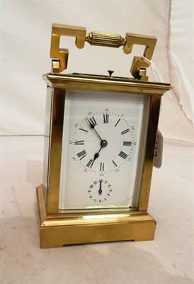 Lot 113 - A gilt brass striking and repeating alarm carriage clock, in a fitted outer case