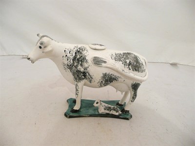 Lot 116 - A pearlware cow creamer (restorations)