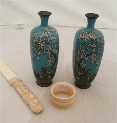 Lot 131 - A carved ivory page turner/letter knife, ivory napkin ring and a pair of cloisonne vases
