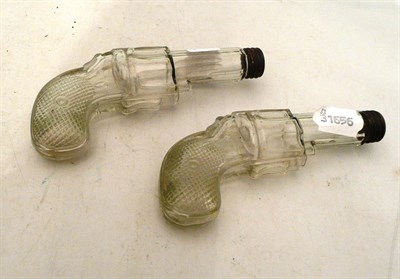 Lot 132 - Two glass pistol-shaped bottles