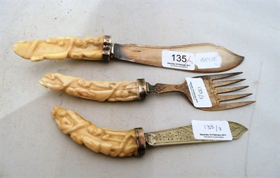 Lot 135 - A carved bone handled fish slice, fork and knife