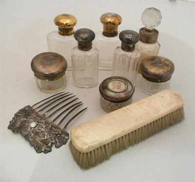 Lot 136 - Eight assorted toilet bottles with silver mounts or tops