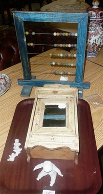 Lot 141 - Painted doll's wardrobe, abacus and four ceramic 'Snow Babies'