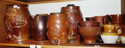 Lot 148 - Shelf of 19th century and later stoneware jugs, storage jars, jelly moulds, water filters etc