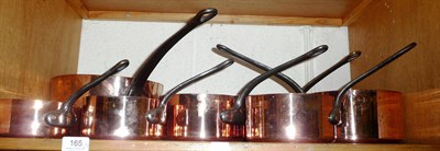 Lot 165 - Two shelves of copper pans