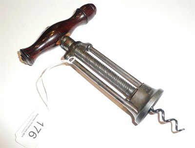 Lot 176 - A wooden handled corkscrew stamped VR