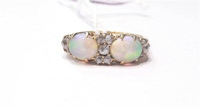 Lot 187 - An opal and diamond ring (opals scuffed)