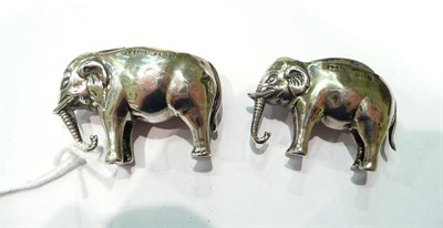 Lot 202 - Two silver elephant pin cushions