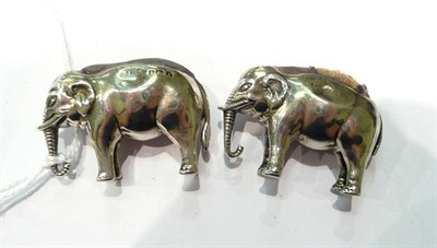 Lot 204 - Two silver elephant pin cushions