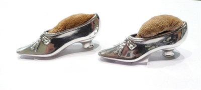 Lot 205 - Two silver shoe pin cushions