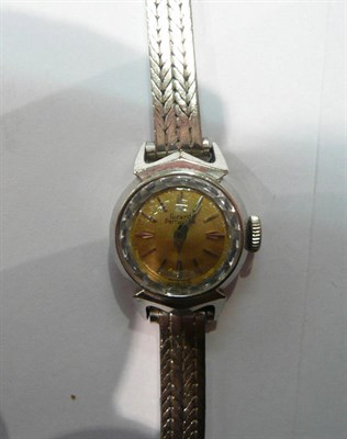 Lot 211 - A Girard Perregaux lady's watch, strap stamped '18K'