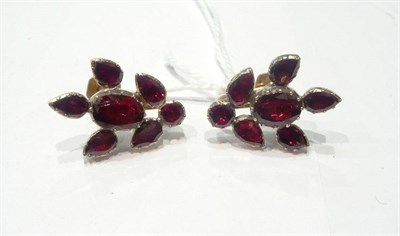 Lot 234 - A pair of foil backed garnets converted to earrings