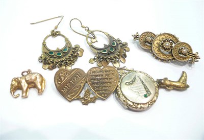 Lot 240 - Two gold charms, two brooches, a locket and a pair of earrings