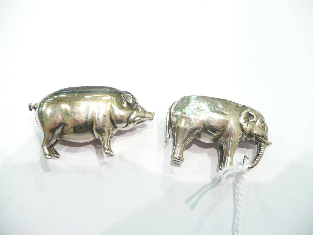 Lot 247 - Silver pig pin cushion and an elephant silver pin cushion